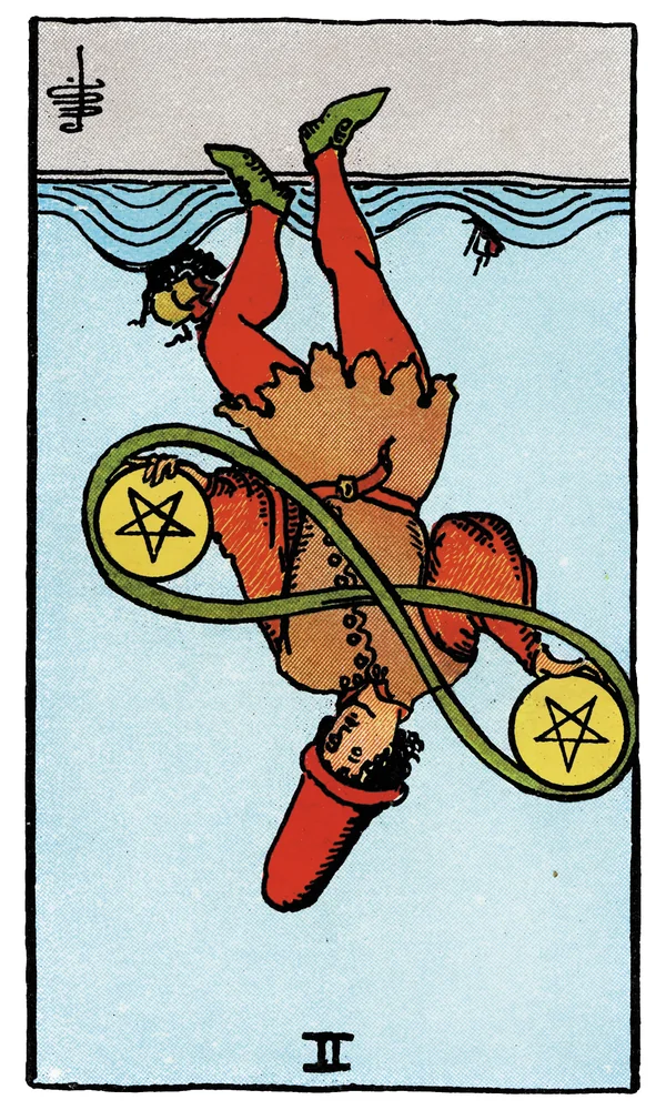 Carte de tarot Deux de Deniers inversée
